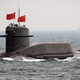 A Chinese sub transits during a 2009 fleet review. Photo credit: AP